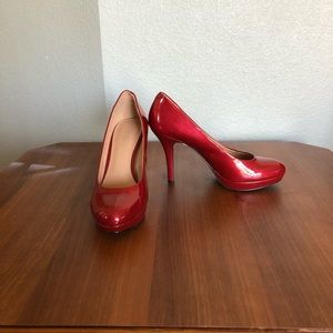 Red patent pumps